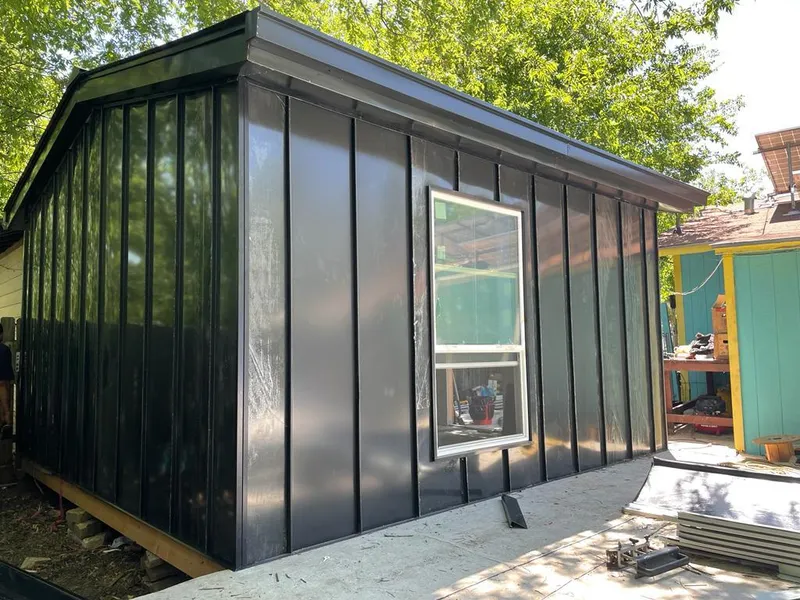 Black standing seam metal wall panels for Metal Roof Installation in Calhoun