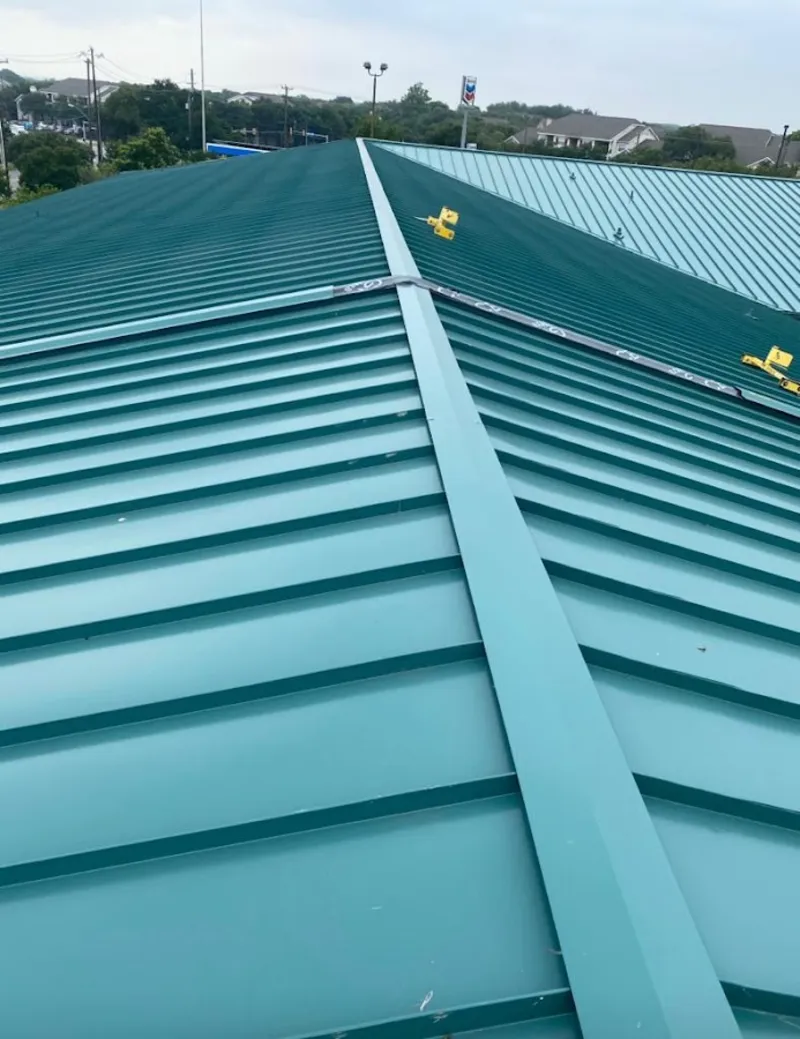 Green commercial metal roof ridge and valley for Metal Roof Repair in Calhoun
